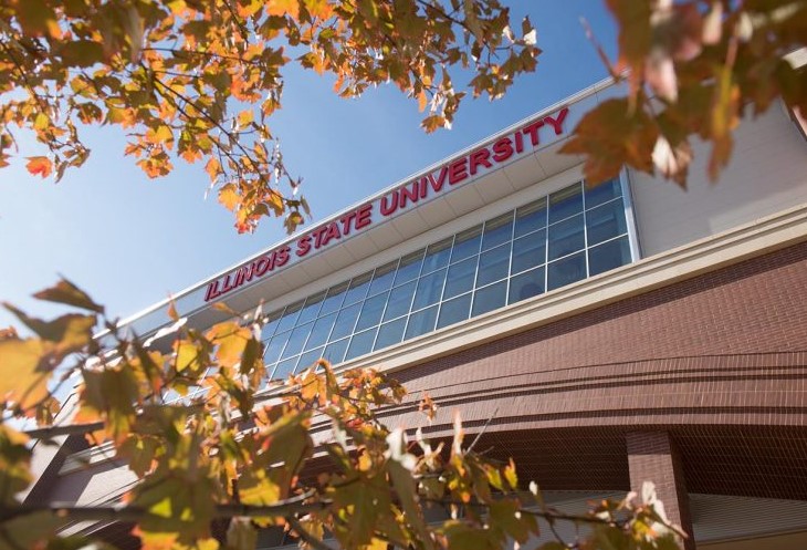 Hancock Stadium viewed through the hanging autumn leaves of trees that adorn that area