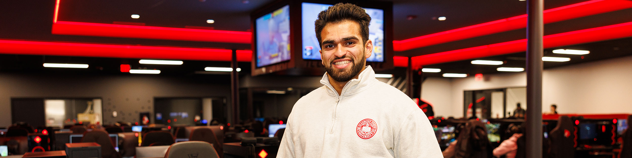 A student worker posing on the eSports room.
